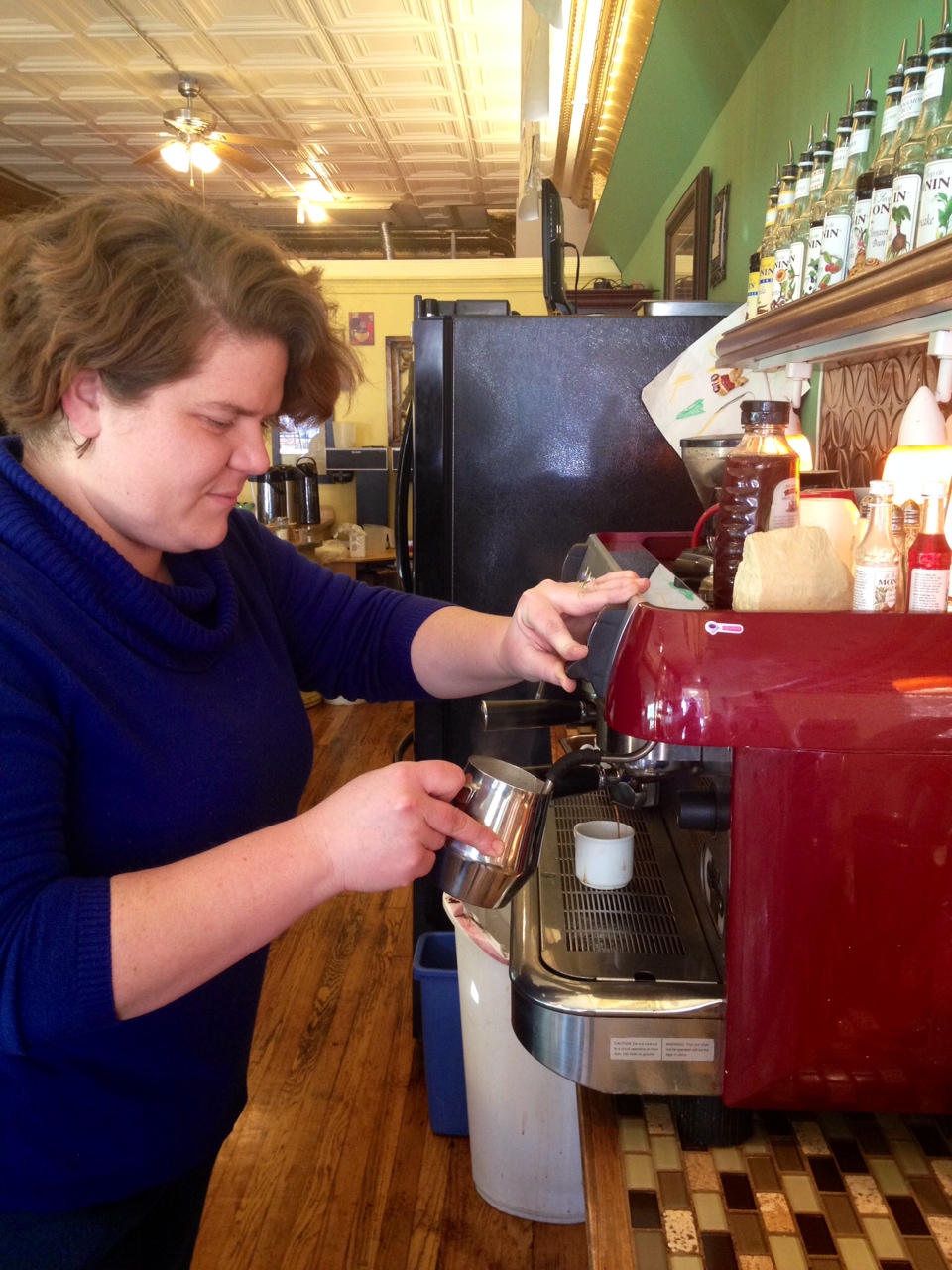 Mitchell practices what she loves by hand pouring a shot of espresso for one of Sweet Espressions signature coffee beverages.
