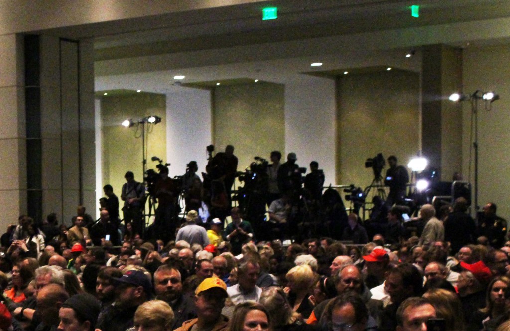 Cameras from a variety of media outlets sit on a raised platform to get a view of the stage. All media were told to stay at the back of the room. Jonah McKeown/TMN