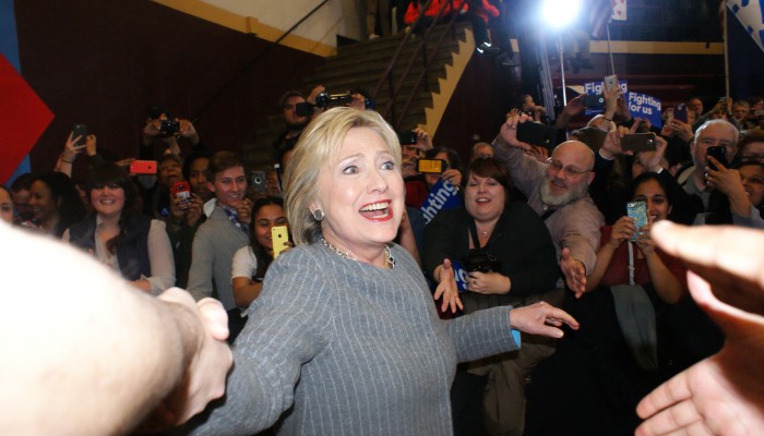 Hillary Clinton shakes hands with audience members before a rally in Des Moines. Photo by Elena Bellamy/TMN.