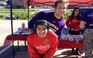 Cardinal Key member Taryn Sohal (front) and Susan Caman volunteering at the Homecoming tailgate with Jake Wehmer. Submitted by Taryn Sohal.