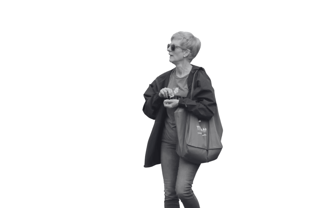 Sue Thomas holding a Truman State University Tote bag.