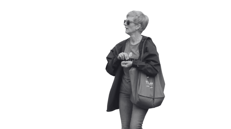Sue Thomas holding a Truman State University Tote bag.